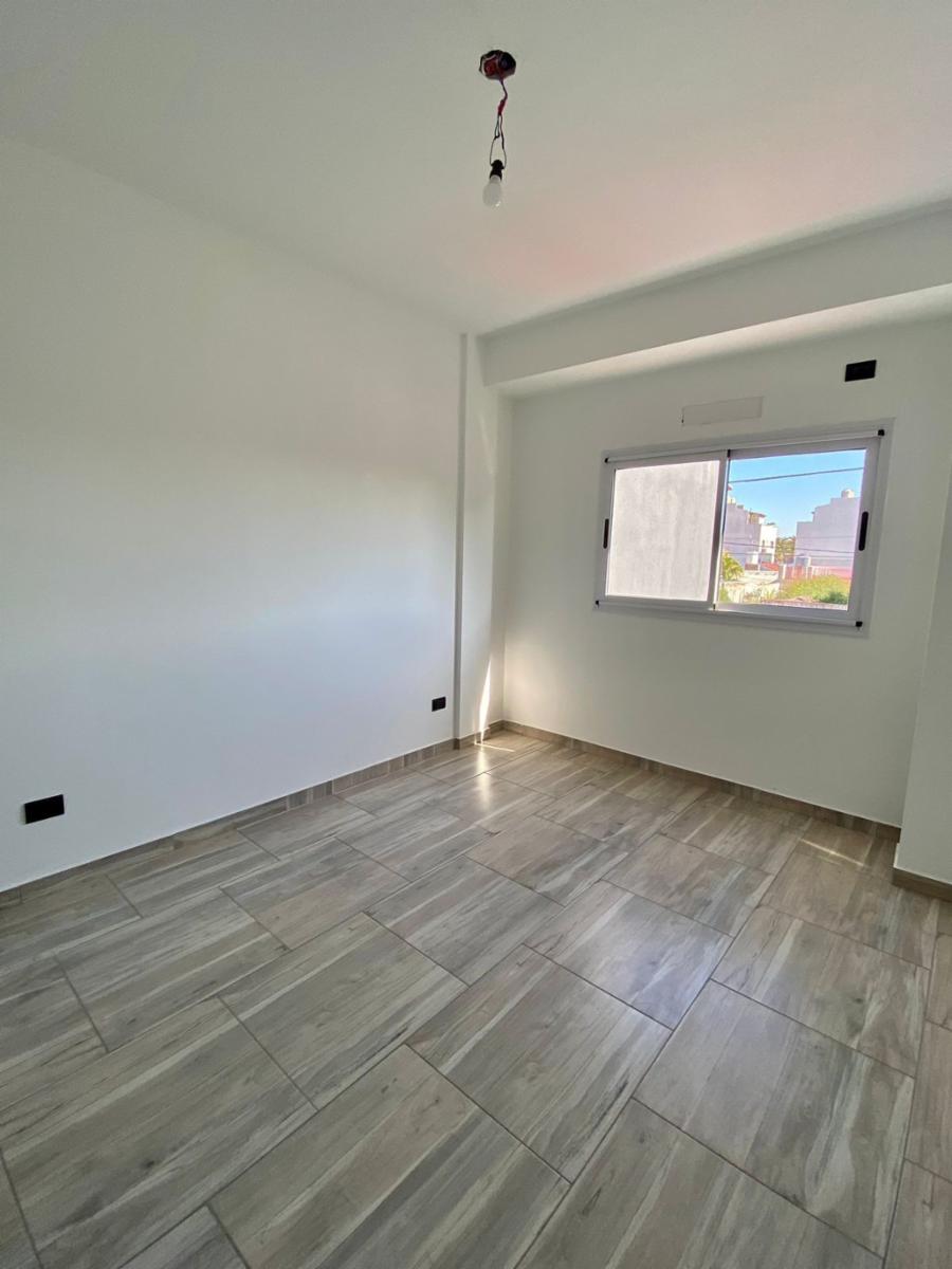 DEPARTAMENTO 2 AMBIENTES AL FRENTE A ESTRENAR CON BALCÓN Y COCHERA. EDIFICIO CON GIMNASIO, TERRAZA Y PARRILLA